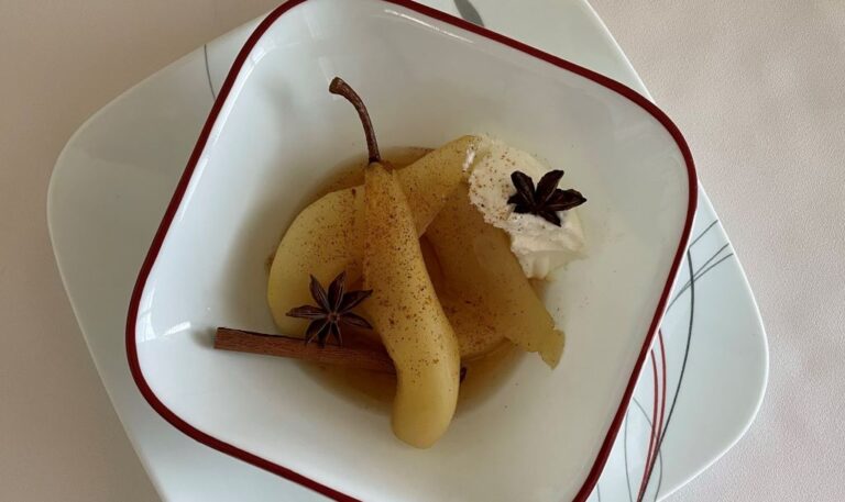 Image of poached pears in a white bowl