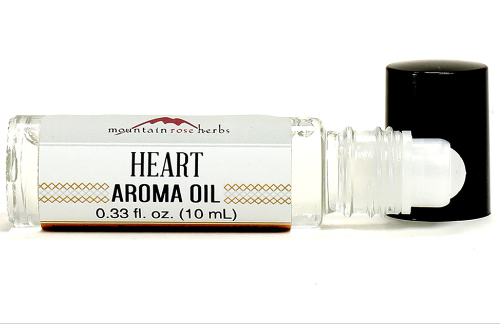 Image of roll-on bottle with heart aroma oil.