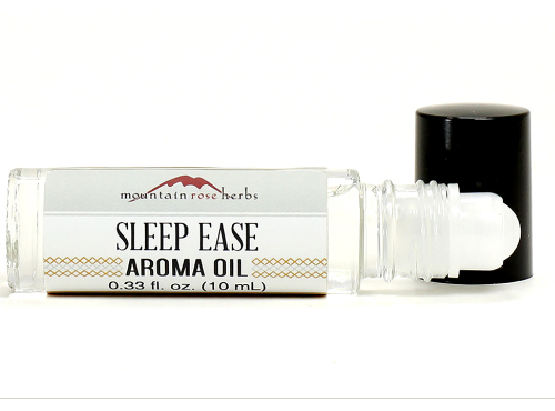 Image of roll-on bottle with sleep ease aroma oil.